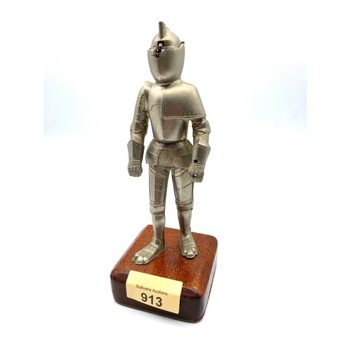 913 - Table lighter in the shape of a knight on a wooden base 20cm High.