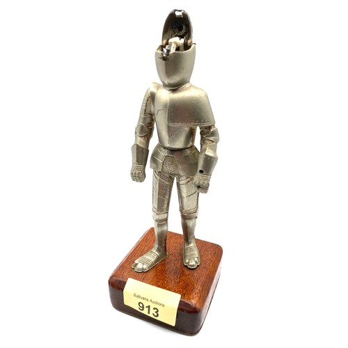 913 - Table lighter in the shape of a knight on a wooden base 20cm High.