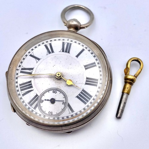 915 - Silver pocket watch and key (working).