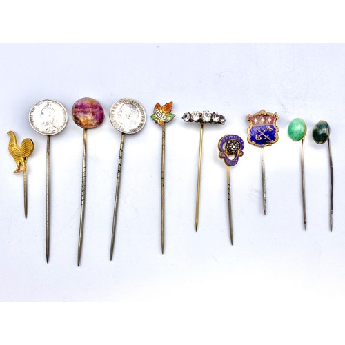 928 - 10 White metal and silver tie pins including some enamel and with gold pins. (NHMMYOMU)