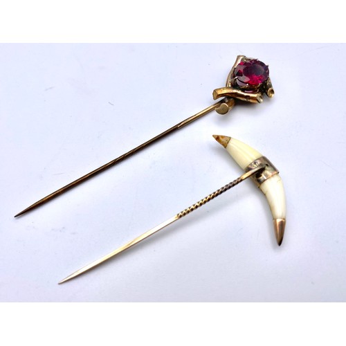 936 - Large cravat pin with a knot and large garnet stone and a pin in the shape of a horn by John bennet ... 