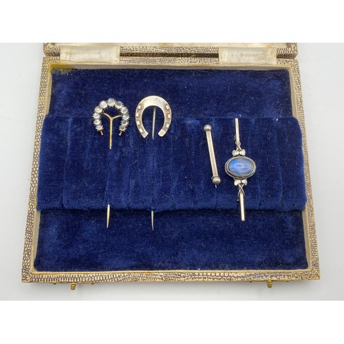945 - Set of four stunning cravat pins and brooches including silver and a yellow metal long pin. Moonston... 