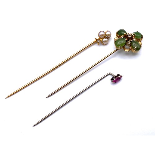 947 - Three tie pins with gold and silver stems, diamonds and a (.25ct pink sapphire) total weight 5.1g (N... 