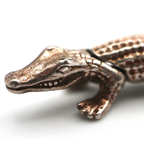 919 - Four silver charms, including two that are articulated, teddy bear alligator, in a wooden box with s... 