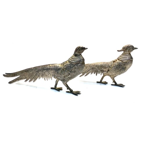 528 - Two pewter pheasant statues 25cm long.