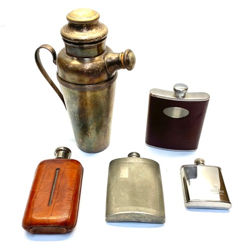 1285 - Four vintage hip flasks and a vintage silver-plated cocktail shaker.