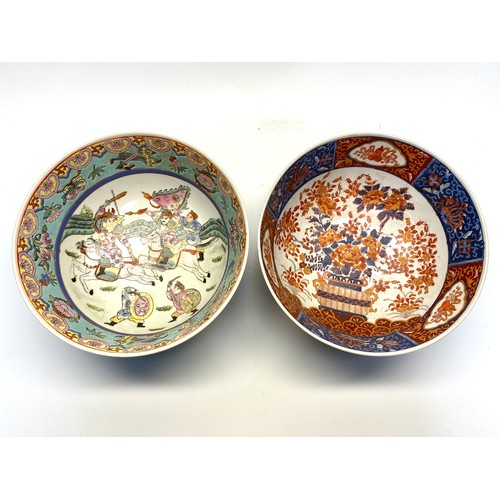 1289 - Two hand painted Chinese bowls with red markings to the rear.