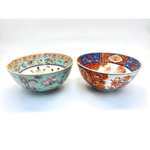 1289 - Two hand painted Chinese bowls with red markings to the rear.