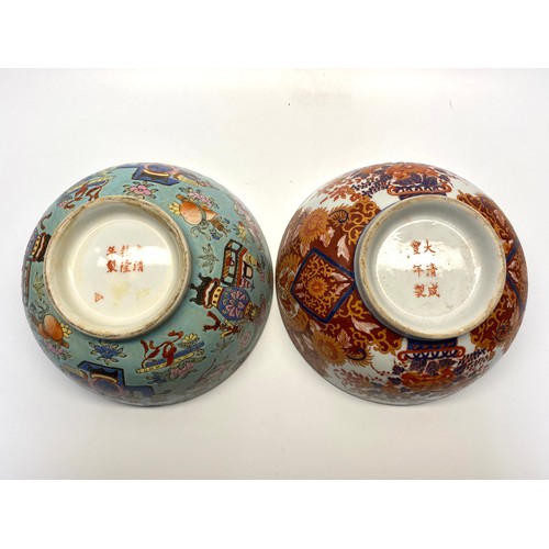 1289 - Two hand painted Chinese bowls with red markings to the rear.