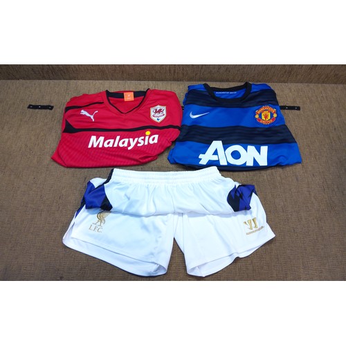 5 - Football shirts. Large Red Cardiff city shirt, Man United 2010 away shirt and size large LFC shorts ... 