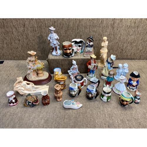 19 - Various resin and ceramic figures, toby jugs, and character jugs.