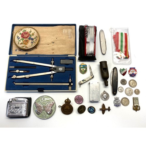 1236 - Vintage items including a L&NWR Whistle, silver coins, military cap badges, enamel badges, lighters ... 