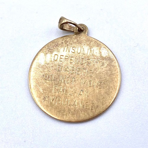 1243 - 9ct gold medical pendant 2.3 grams.