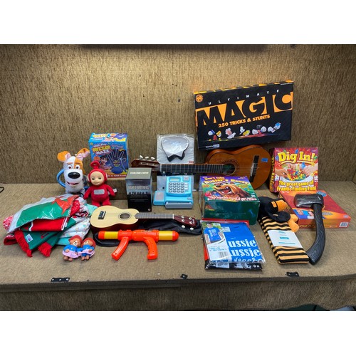 28 - Mixed boxed games, toys, a ukulele and a acoustic guitar.