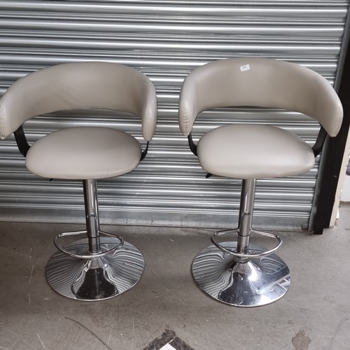 63 - Pair of chrome and leather modern breakfast bar stools.
