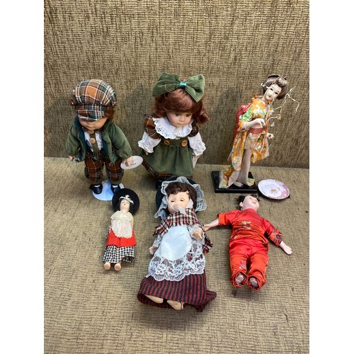 87 - Collection of mostly ceramic dolls including vintage Japanese dolls.