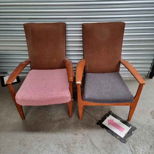 97 - A pair of Parker Knowles arm chairs.