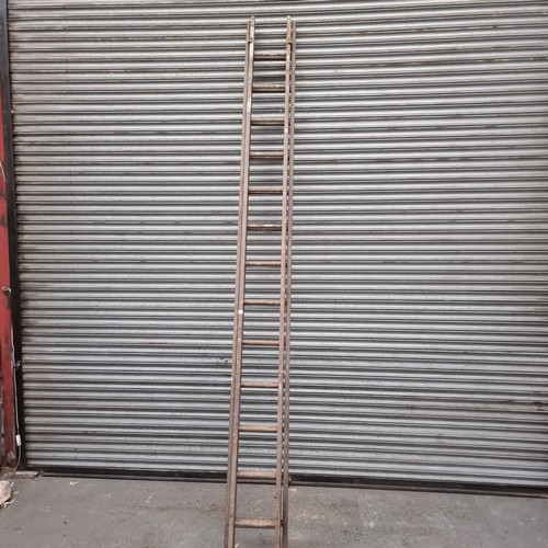 100 - Large set of wooden ladders.