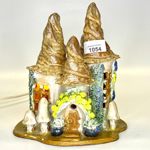 1054 - Handcrafted pottery wizards house crafted by Jane Harman-Hall. 24cm tall.