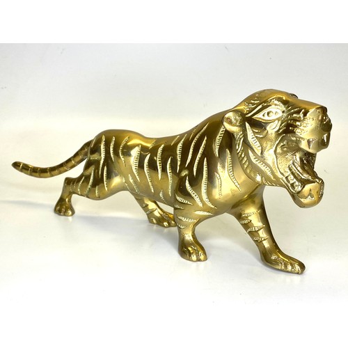1055 - Solid brass tiger figure. 41 cm long.