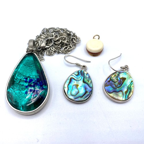 513 - White metal arts & crafts pendant and earrings tests as silver and a yellow  metal pendant tested as... 