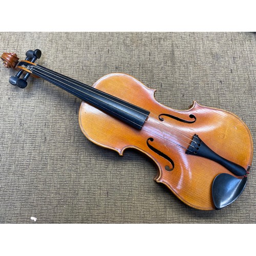 1091 - Reproduction Stradivarius Violin in a leather case.