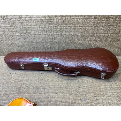 1091 - Reproduction Stradivarius Violin in a leather case.