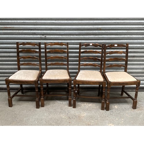 180 - Four oak ladder back dinning chairs .