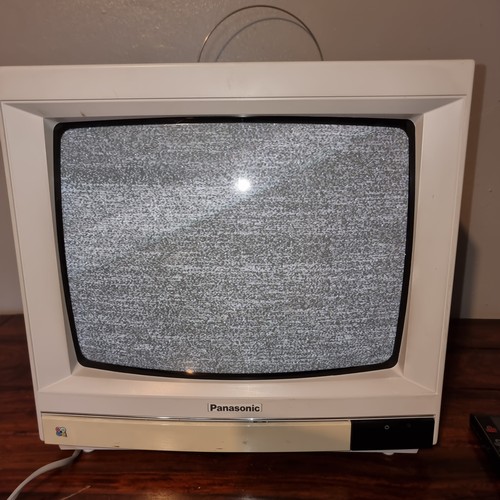 214 - Vintage Panasonic TC-1485 portable tv with original remote control.