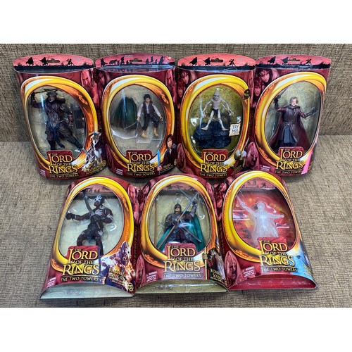 712 - Toybiz Lord Of The Rings The Two Towers 7 boxed figures including  Frodo with light up Sting ,Berser... 