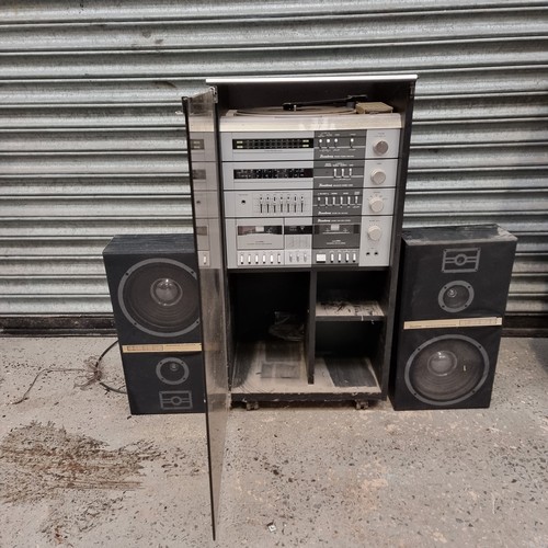 1566A - Binatone hifi stereo in a glass and wooden cabinet with speakers.