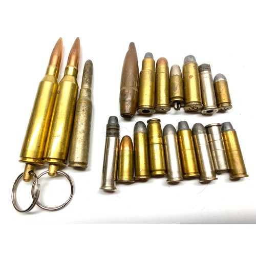 1278 - Collection of fired bullets and Two .338 LM bullet keyrings.