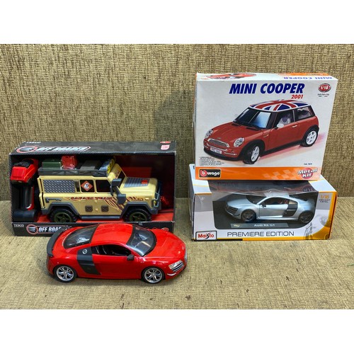 747 - Boxed Off reader jeep, Boxed Burago Mini Cooper metal kit and a Maisto Premier Edition 1:18 diecast ... 