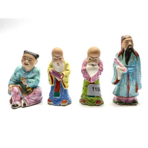 1158 - Four hand painted ceramic Japanese figures.