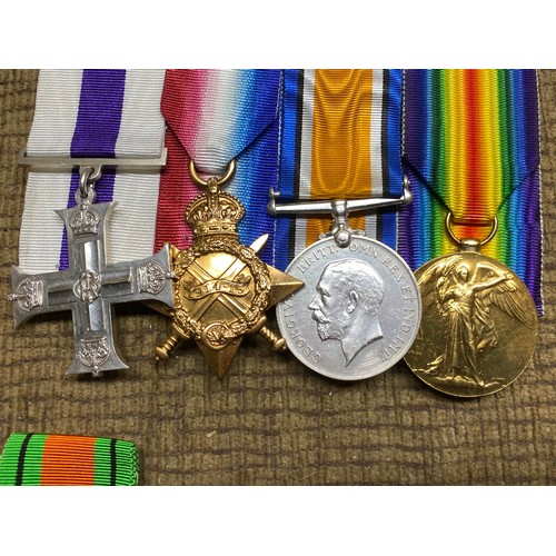 1311 - Replica Military Cross set of medals. Major E P Manson. Set does contain one letter and some origina... 