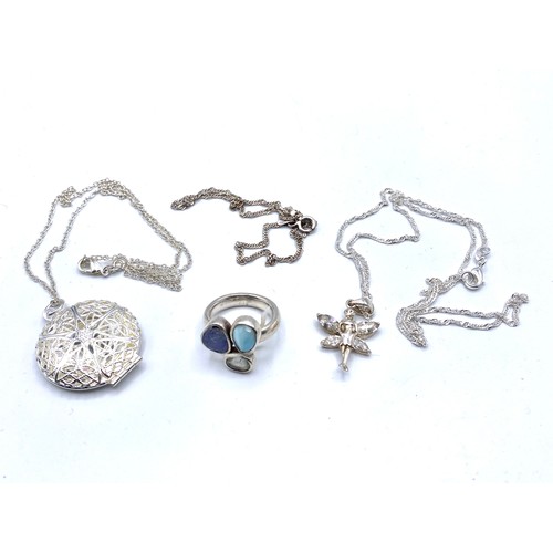 854 - Two silver necklaces with silver pendants, a silver ring and a silver Bracelet.