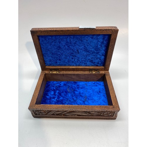 666 - Antique Chinese carved wooden jewellery box with a velvet lining.