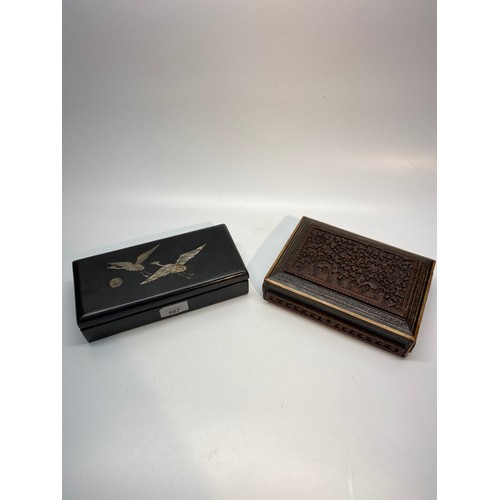 667 - Ebony and mother of pearl jewellery box and a wooden carved jewellery box.