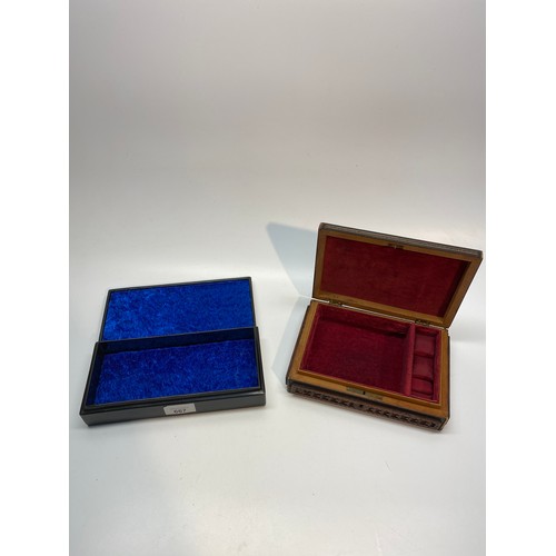 667 - Ebony and mother of pearl jewellery box and a wooden carved jewellery box.