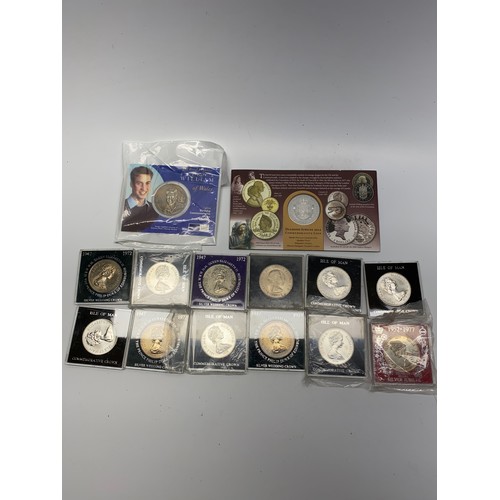 669 - Collection of coins including 11 cased commemorative crown coins.