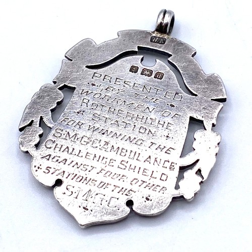 879 - Large sterling silver and gold fob. Awarded for winning the ambulance challenge shield.