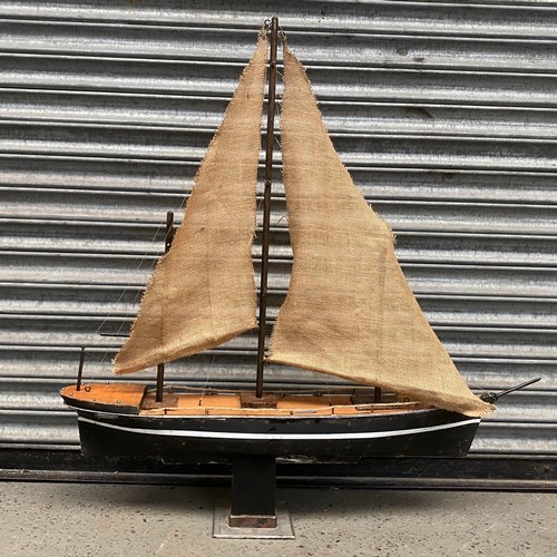 1102 - Large wooden ship on a stand with hessian sails 92cm wide x 95cm tall.