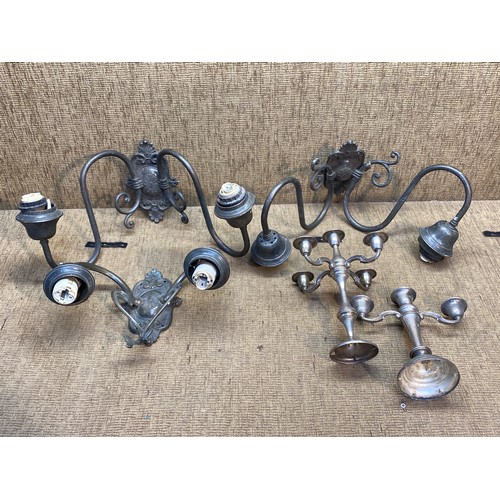 1103 - Three antique bronzed wall lights and two silver plate candelabras.