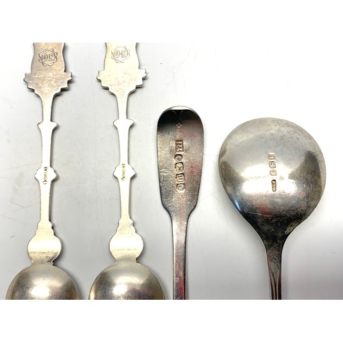 890 - Five spoons including British sterling and continental silver.