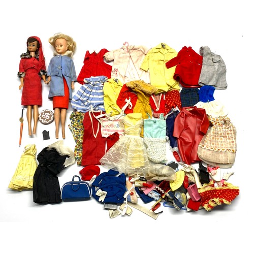 691 - Two vintage barbie dolls with accessories.