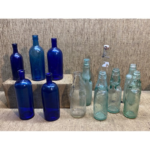 1158 - Selection of clear and blue vintage bottles .