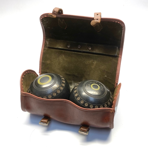 702 - Thomas Taylor bowls in leather carrying case.