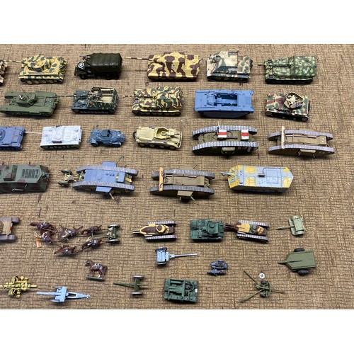 1221 - Large quality of worldwide military tanks in plastic and diecast made complete in kit form.