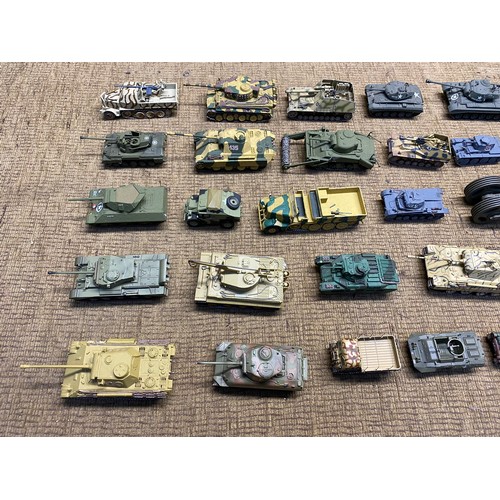 1222 - Large quality of worldwide military tanks in plastic and diecast made complete in kit form.