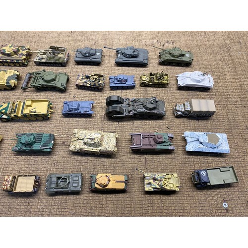 1222 - Large quality of worldwide military tanks in plastic and diecast made complete in kit form.